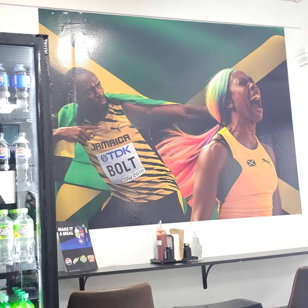Jamaican runners on the Jamaican Flag