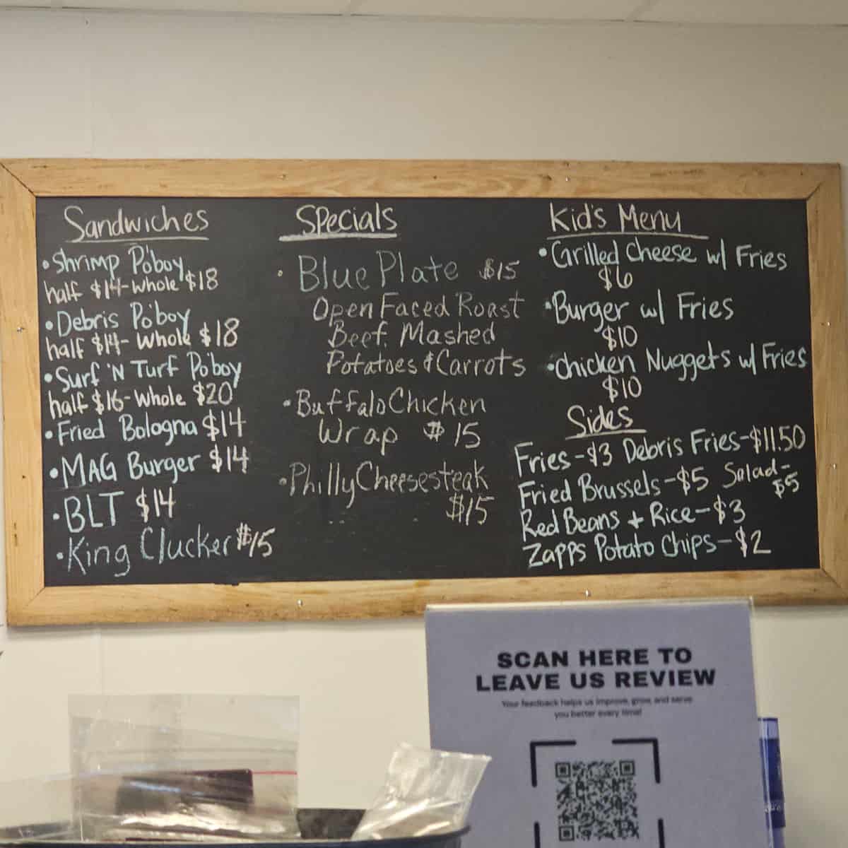 menu with sandwiches, specials, and kids menu on a chalk board