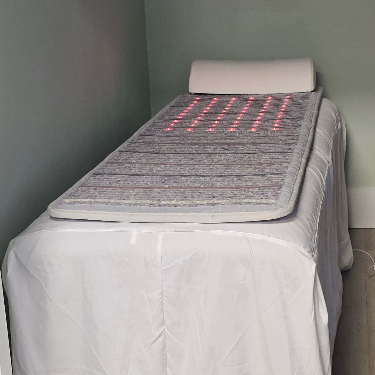 PEMF Therapy Bed with white linens