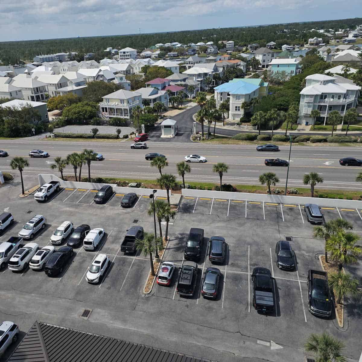 looking over a parking lot, buildings in the background