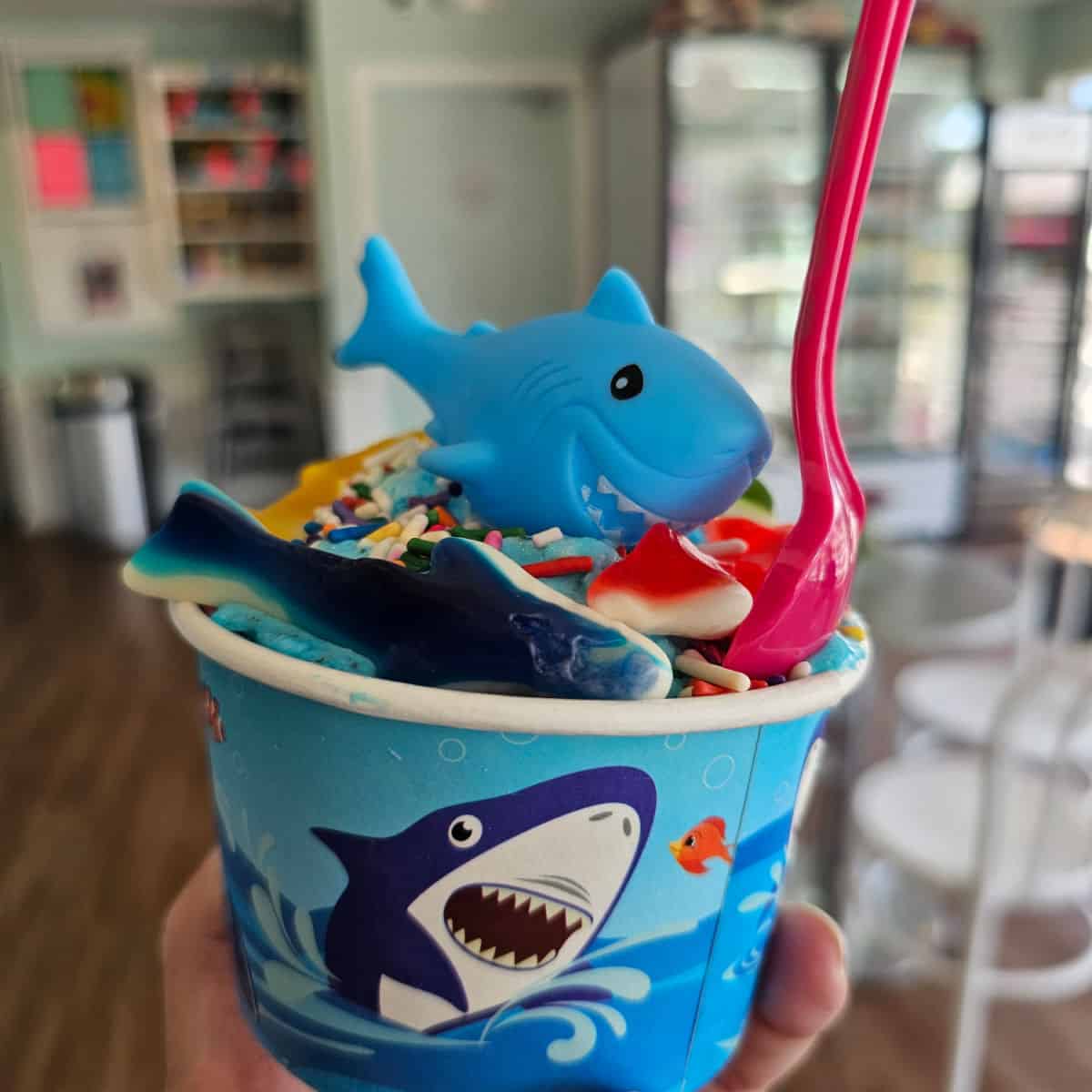 shark sundae with blue shark on top and a red spoon
