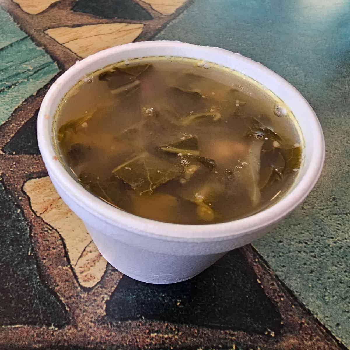 swamp soup in a styrofoam bowl on a table