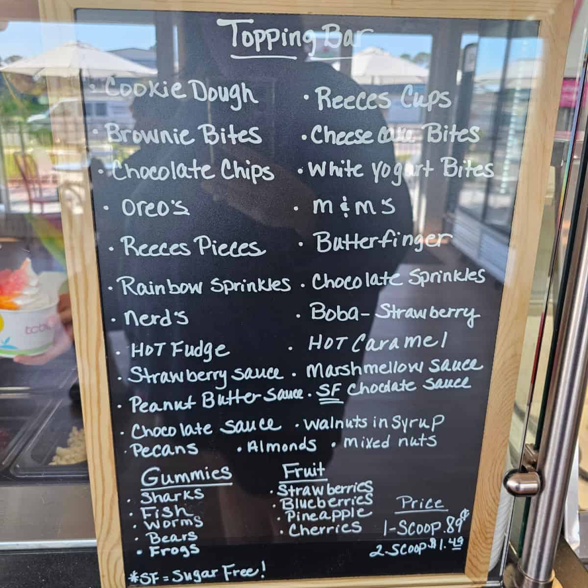 Topping menu listed on a menu board
