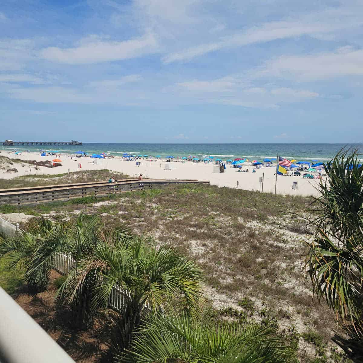 looking out from the balcony to the sand dunes, white sand beach, and Gulf waters