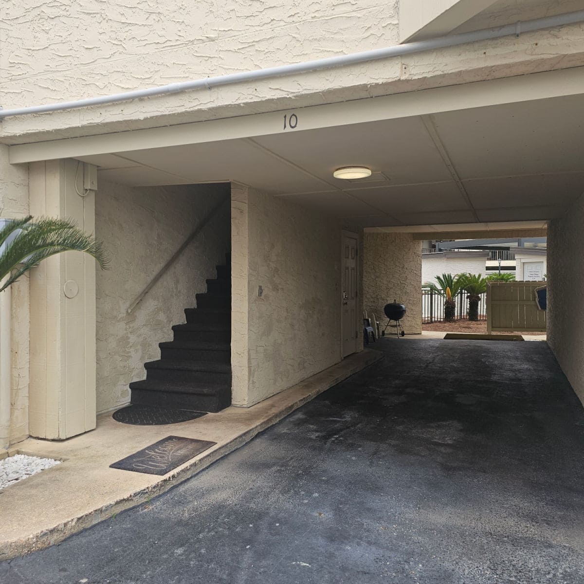 parking under Gulfside Townhomes with stairs leading up to unit 10