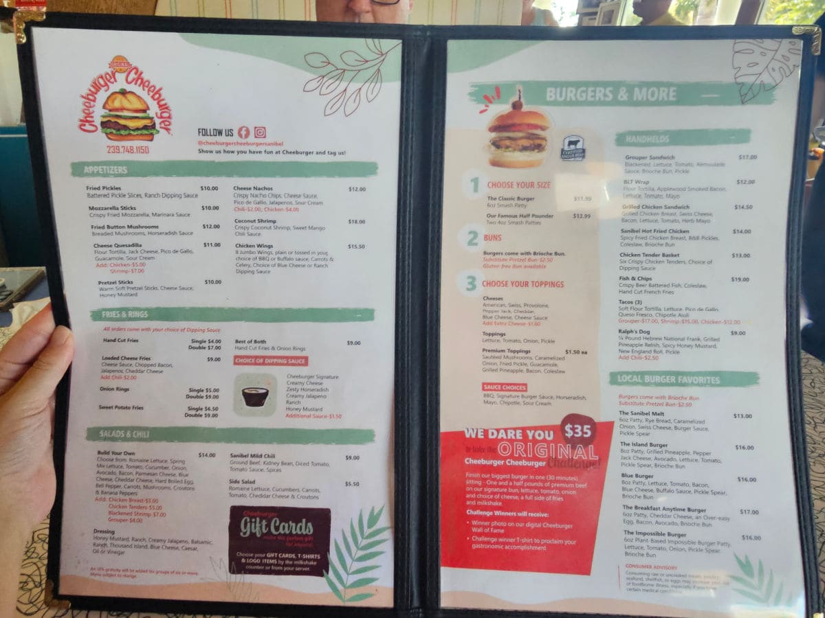 cheeburger cheeburger logo on the menu with appetizers, fries and rings, salads, burgers and more.