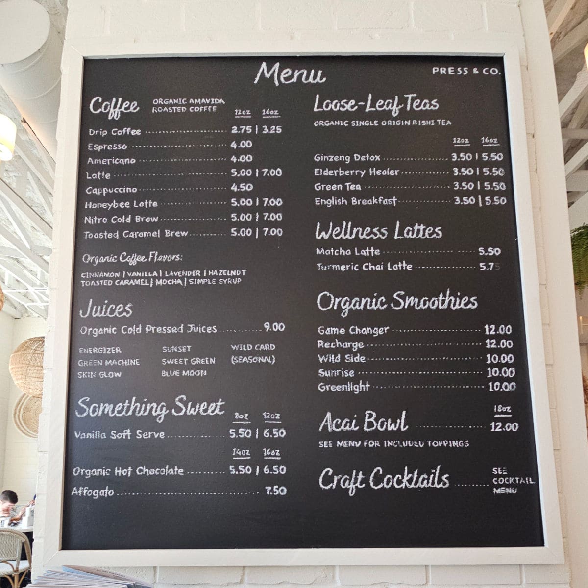 Press & Co menu with coffee, juices, something sweet, loose leaf tea, wellness lattes, organic smoothies, and acai bowls