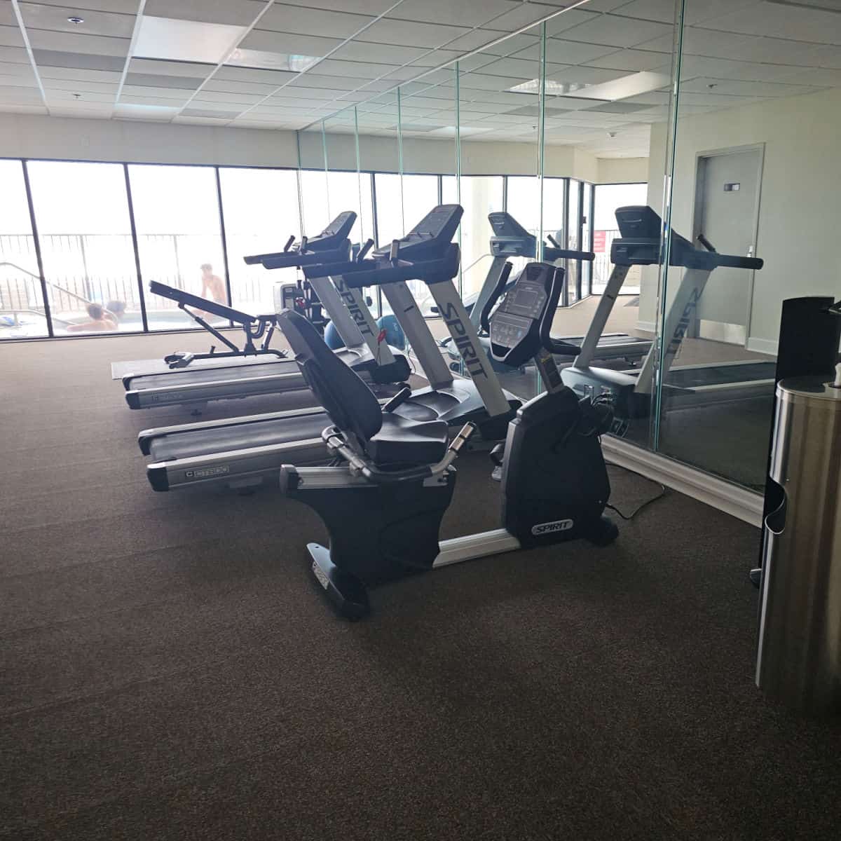 Fitness center with treadmills and exercise bikes at Gulf Coast Journeys.
