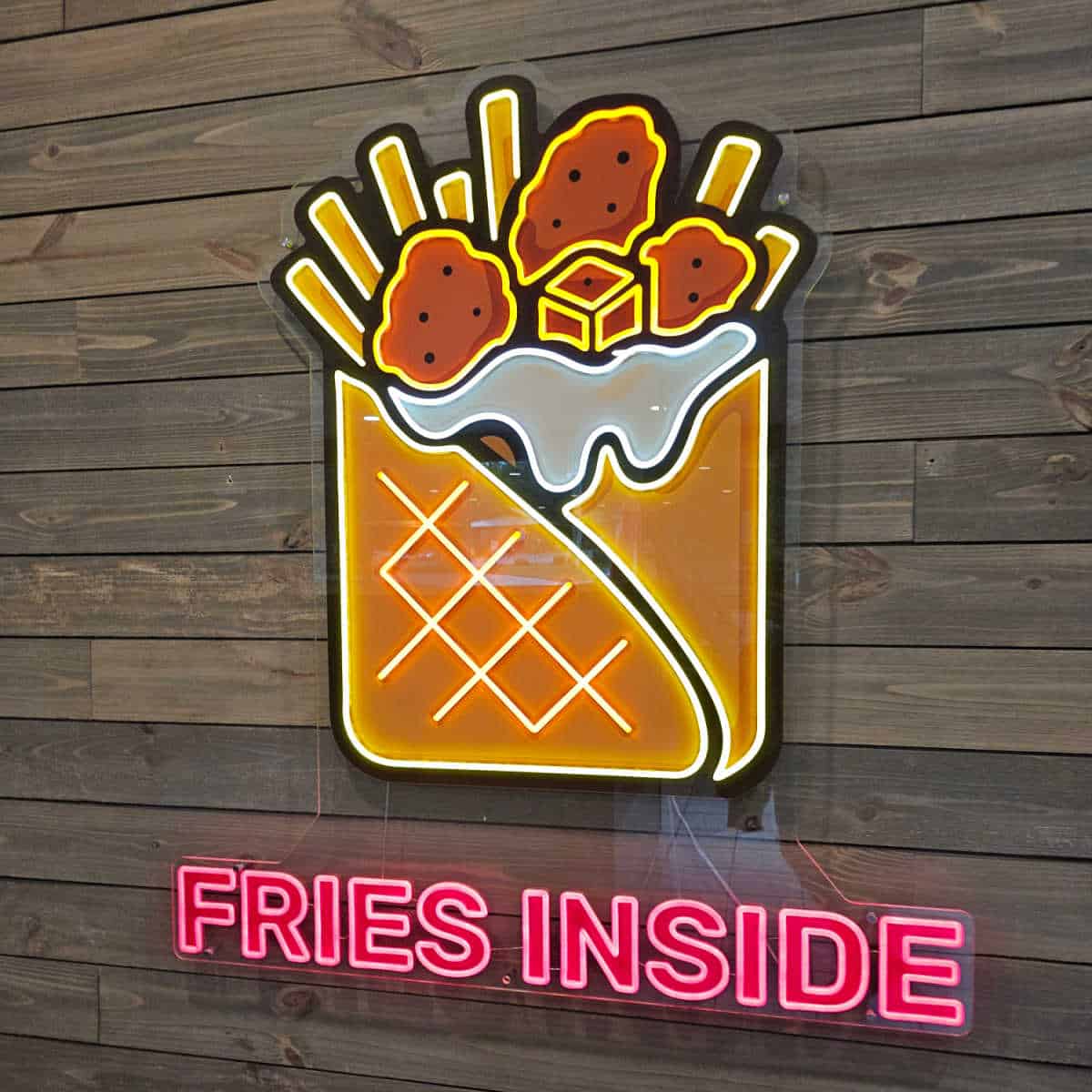Fries inside sign with a wrap with fries coming out of it