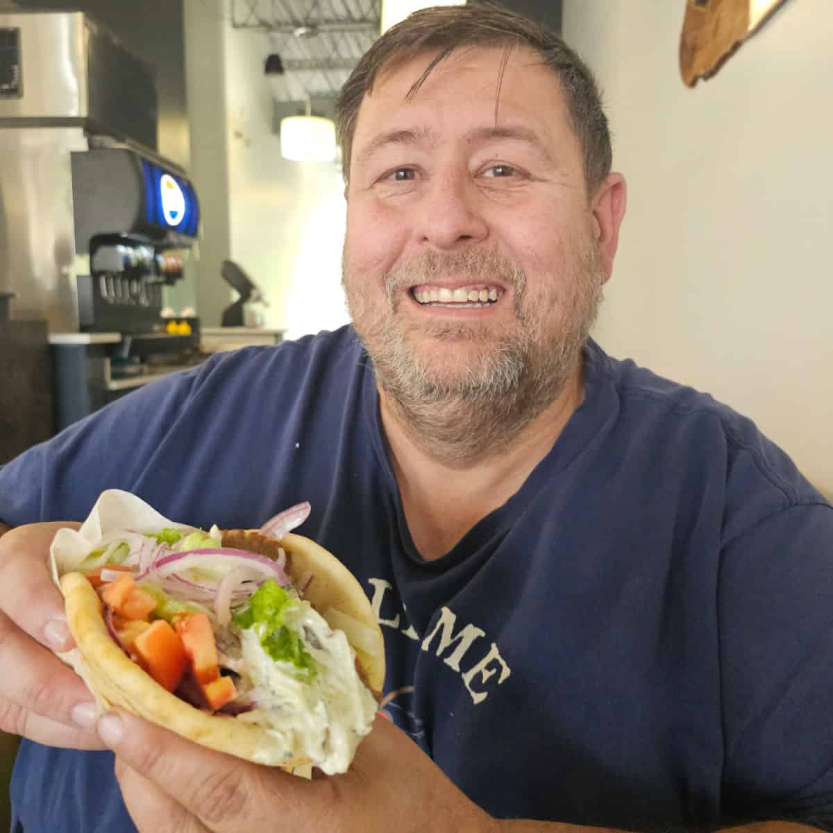 John holding a gyro
