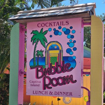 Bubble Room Captiva Island Lunch and dinner pink sign with a jukebox on it