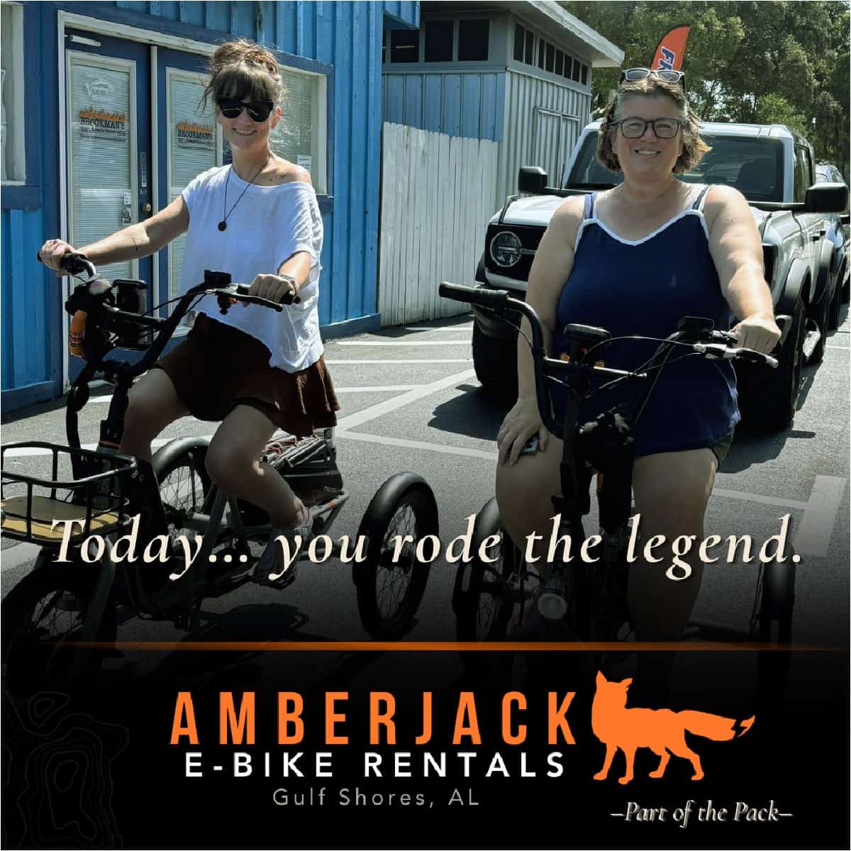 Tammilee and friend on e-trikes with "Today..you rode the legend, Amberjack E-Bike Rentals Gulf Shores below the photo