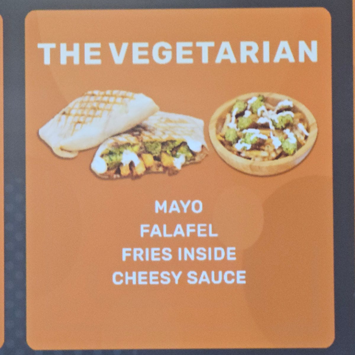 The Vegetarian with mayo, falafel, fries inside, cheesy sauce and images of food