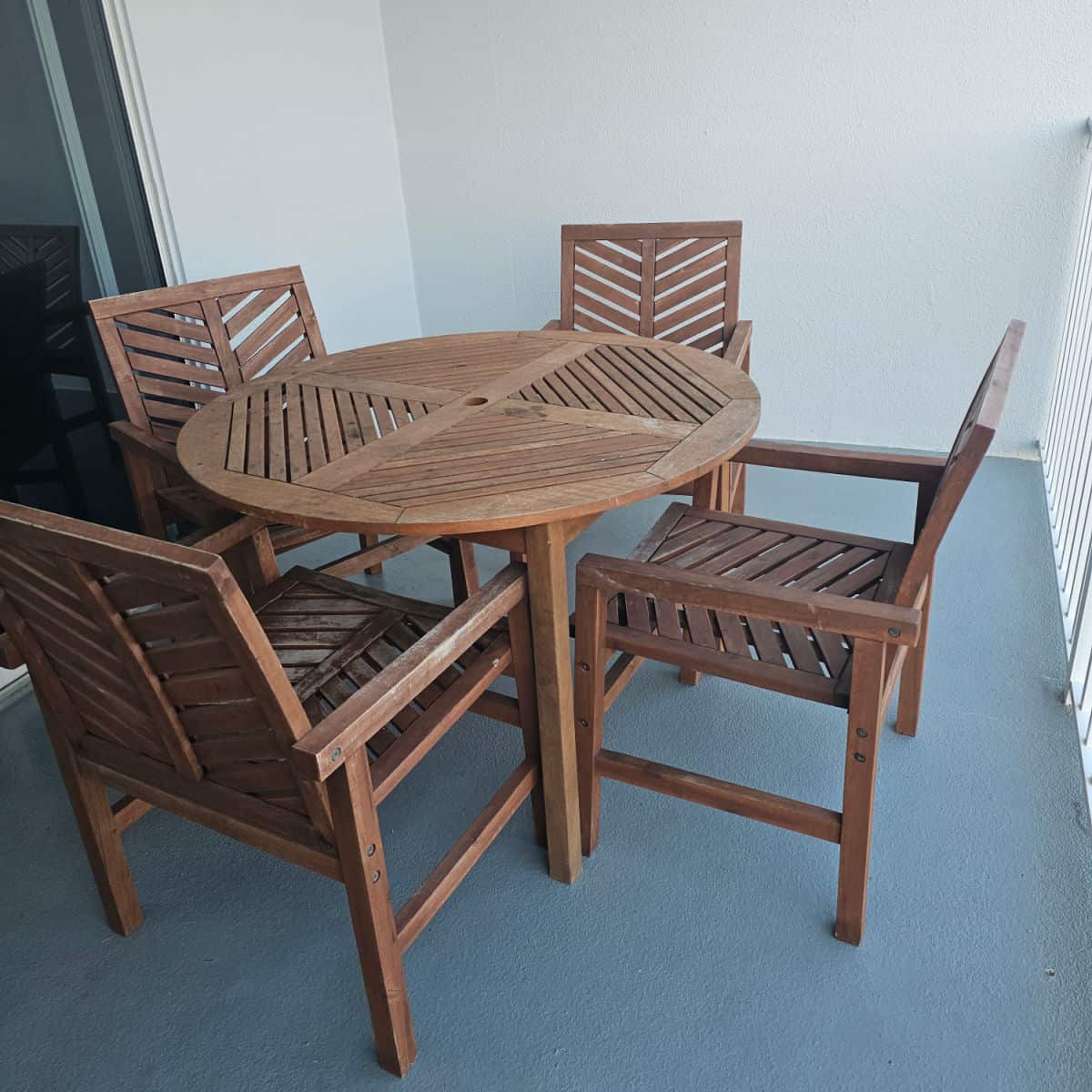 balcony with wooden table and chairs