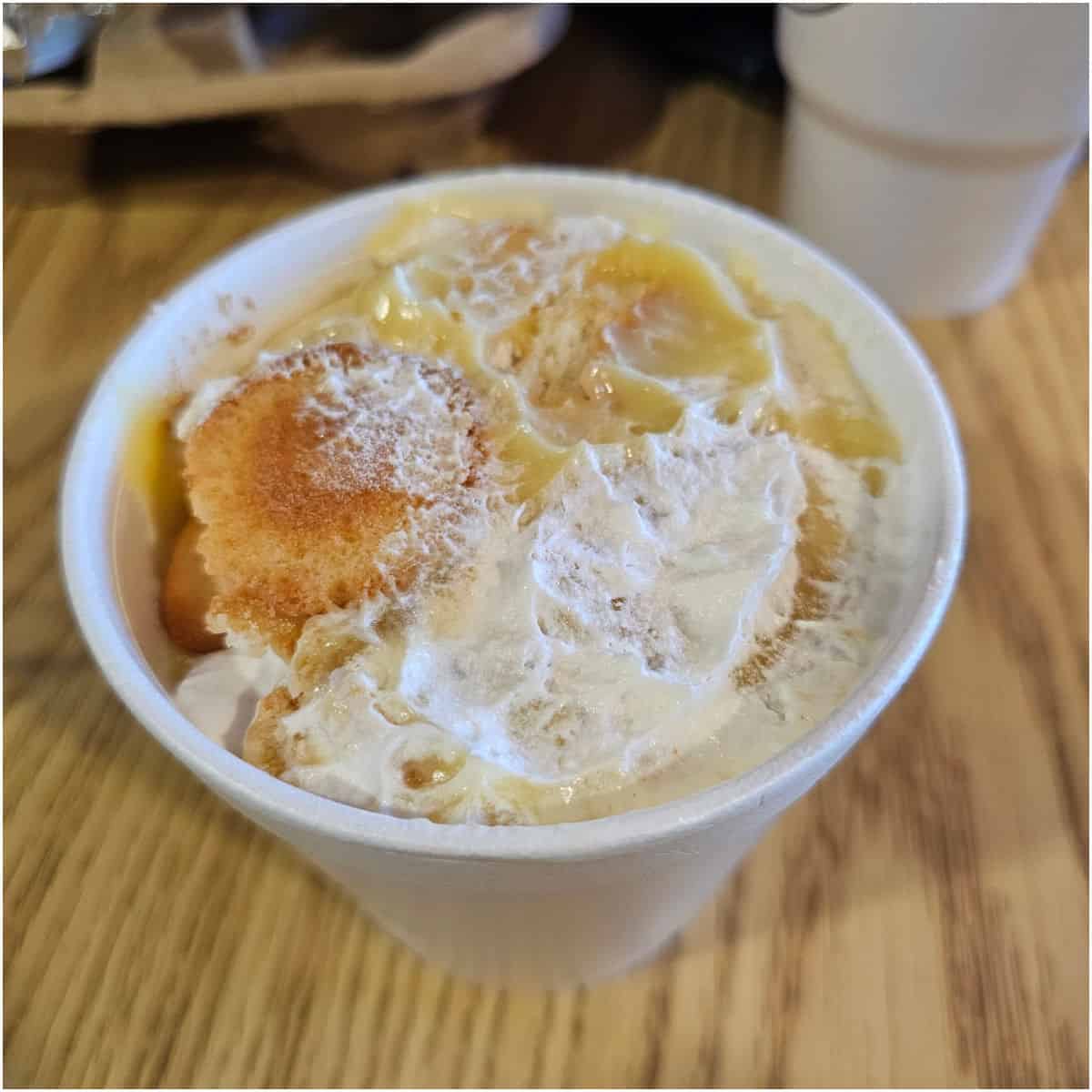 banana pudding in a styrofoam container on a table