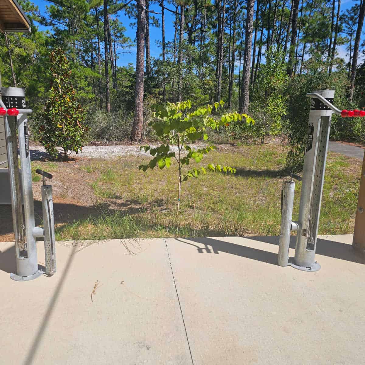 bike repair area with a trail running behind it