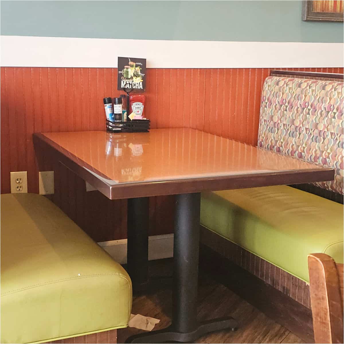 booth with green padded seats