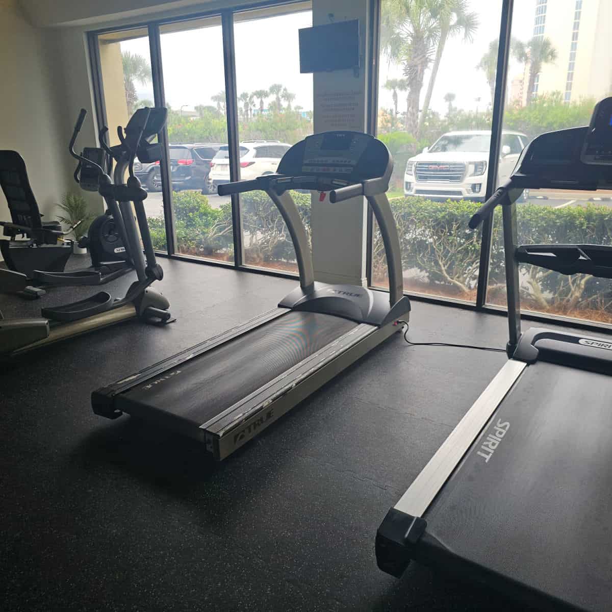 fitness center with treadmill and eliptical machine