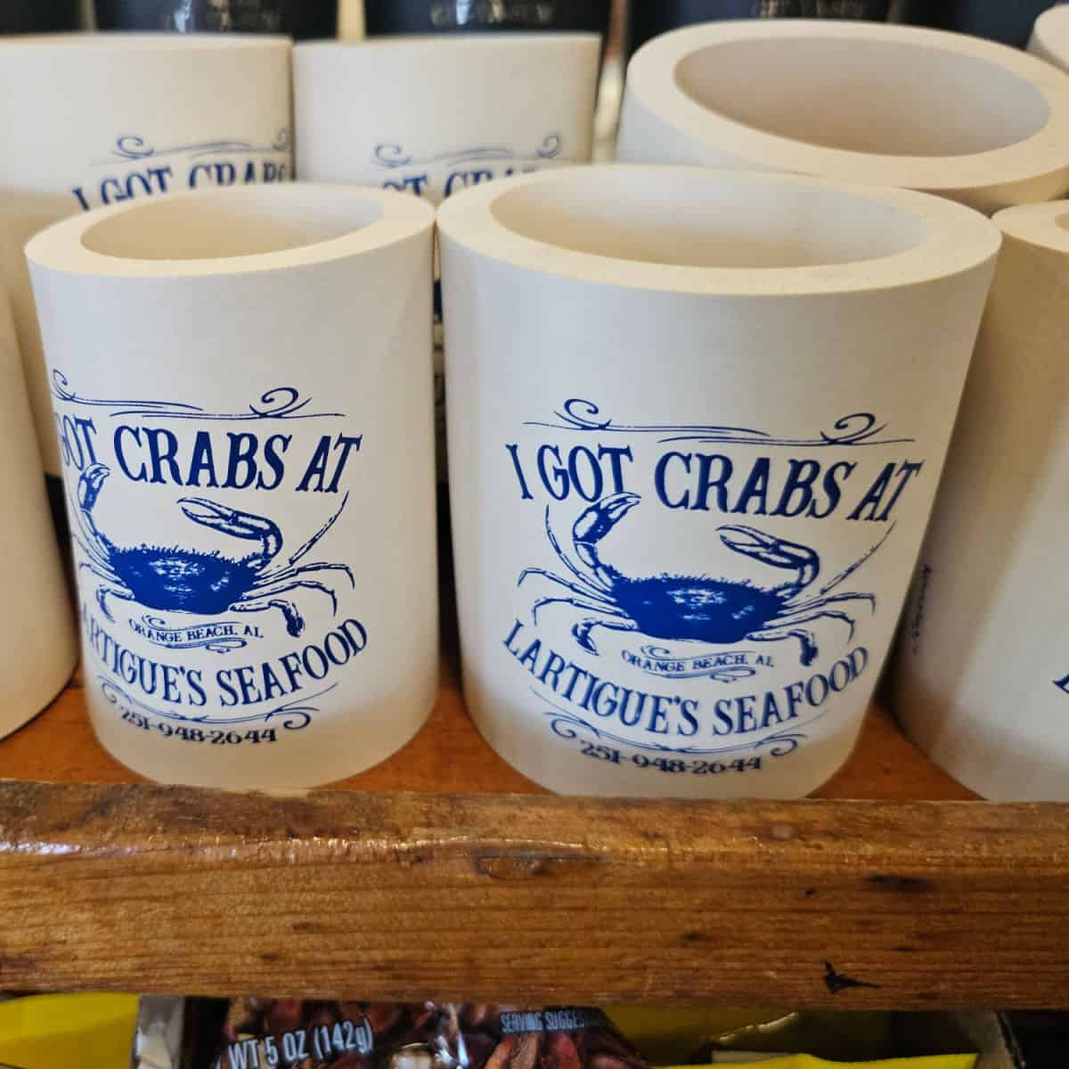 I got crabs at Lartigues seafood koozies in a row