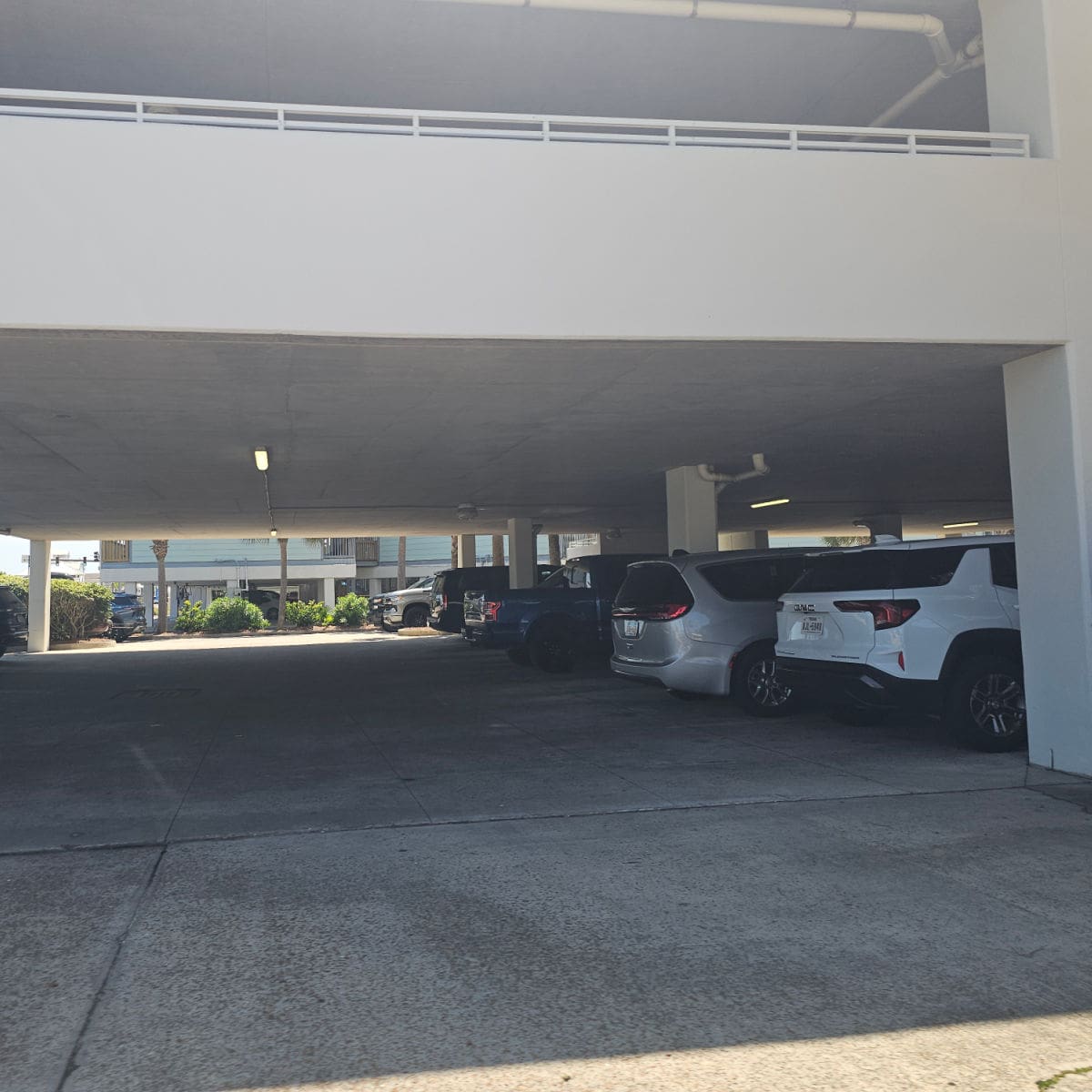 parking area with multiple levels showing the cars on the main level