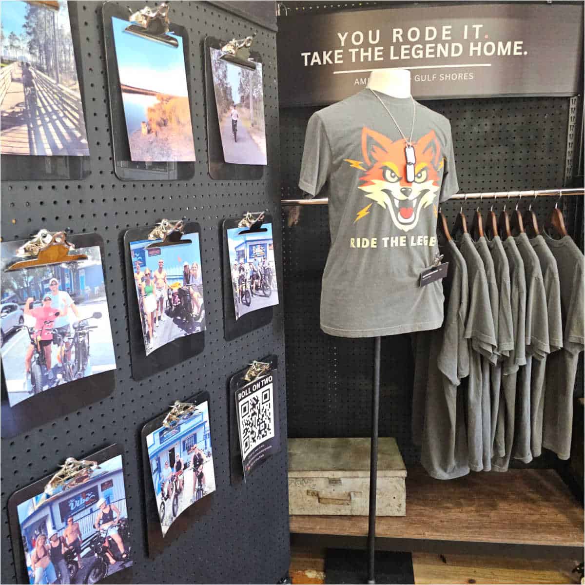 You Rode it, take the legend home sign by a shirt with a fox on it, and a wall of photos