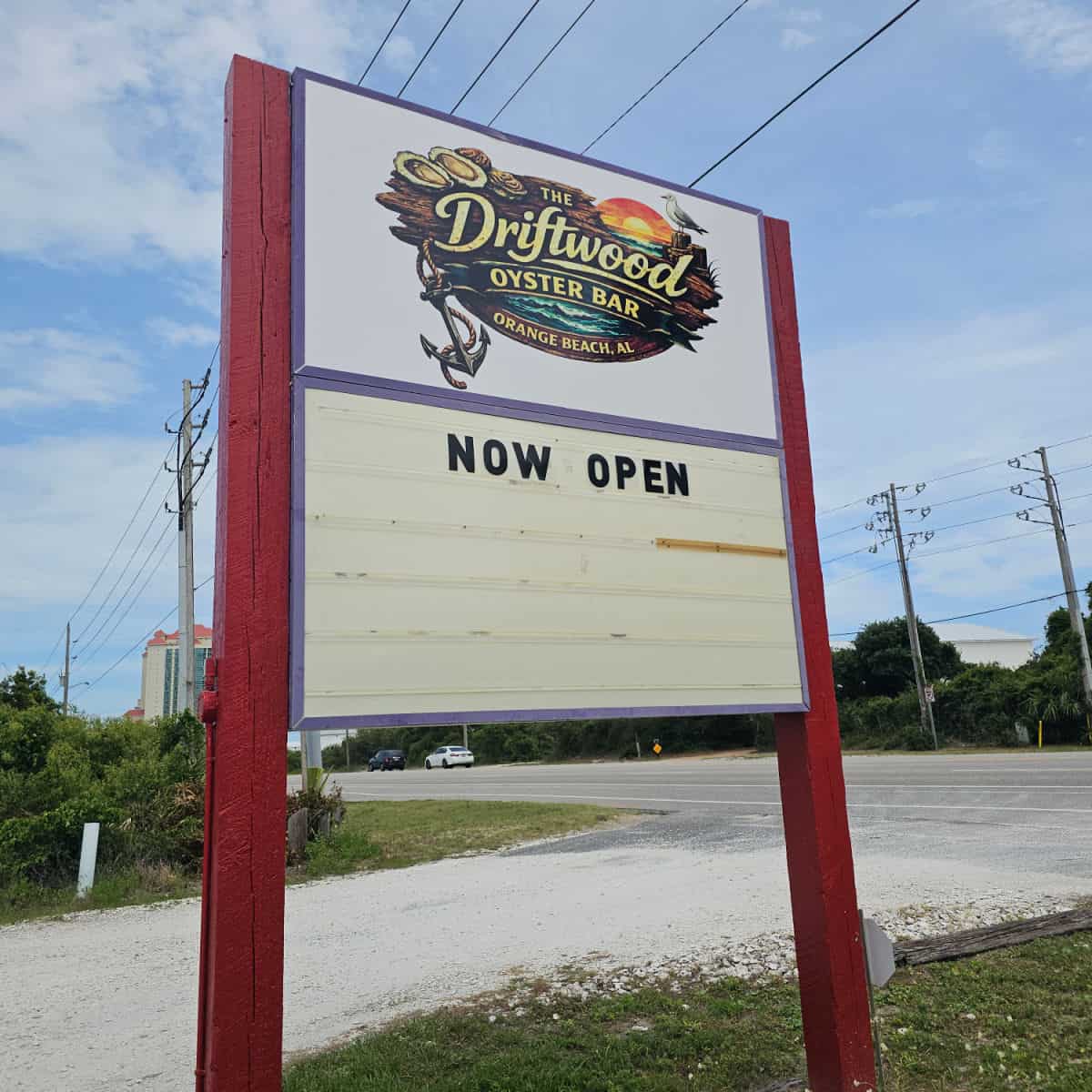 The driftwood oyster bar sign with now open on it