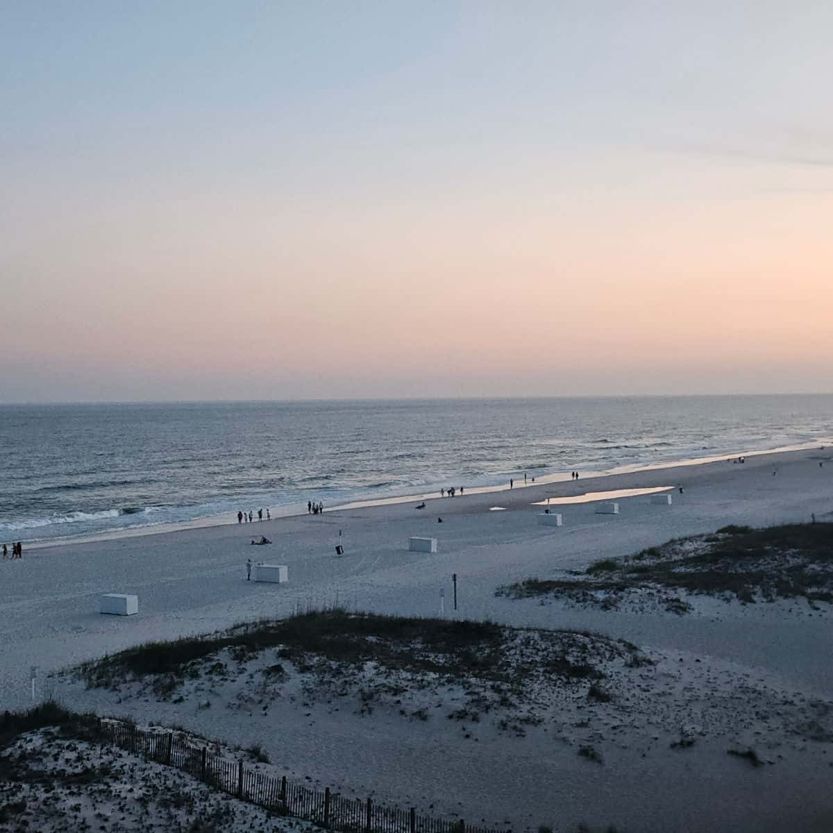 sunset sky over the beach with sand dunes
