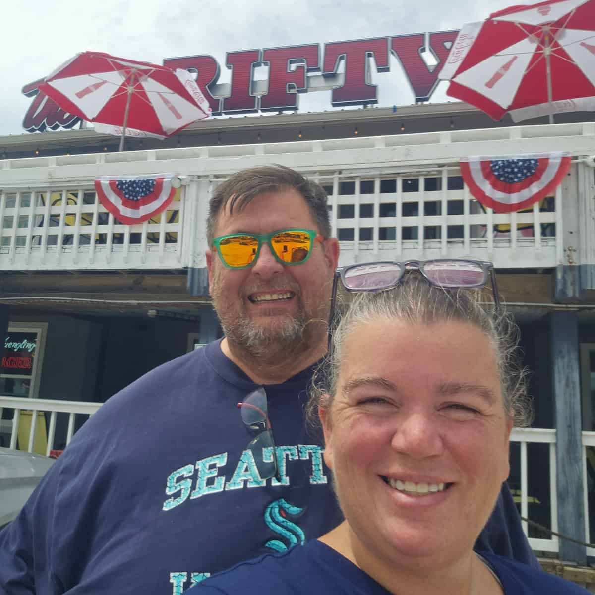 tammilee and John in front of driftwood oyster bar