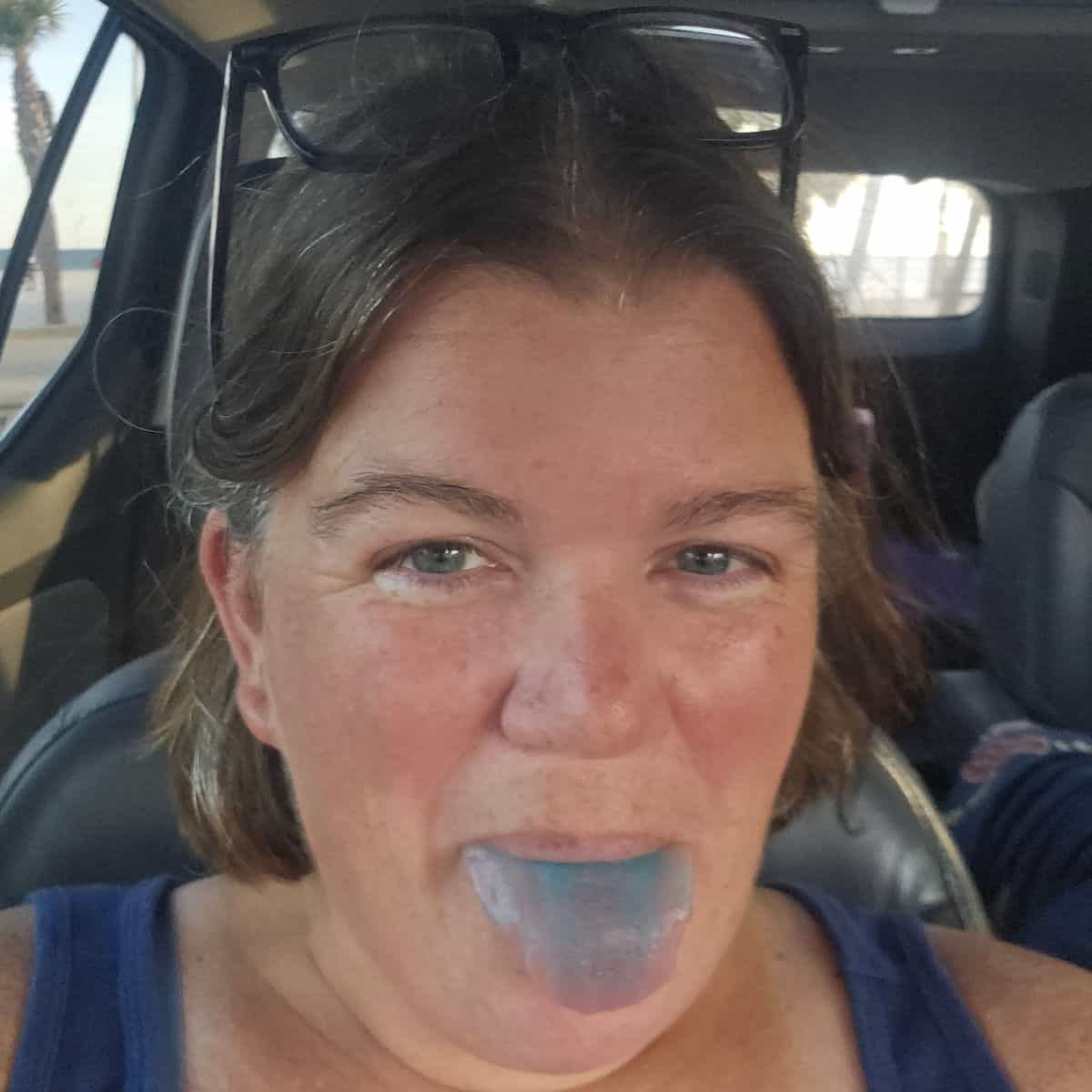 Tammilee smiling with a blue tongue