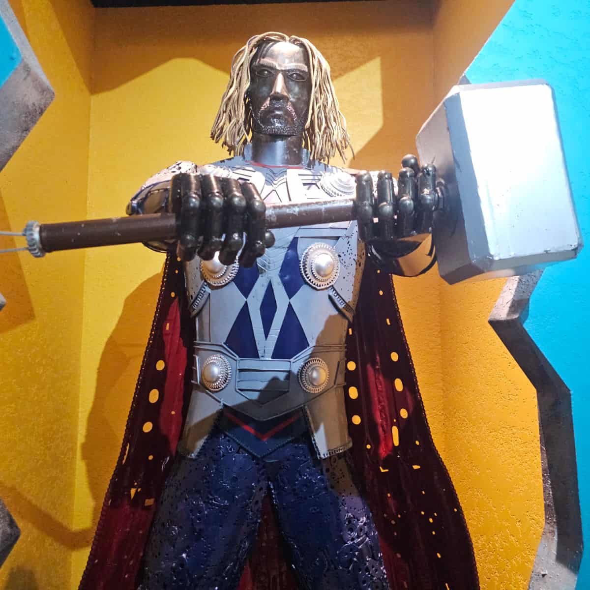 Metal Thor sculpture with a silver hammer