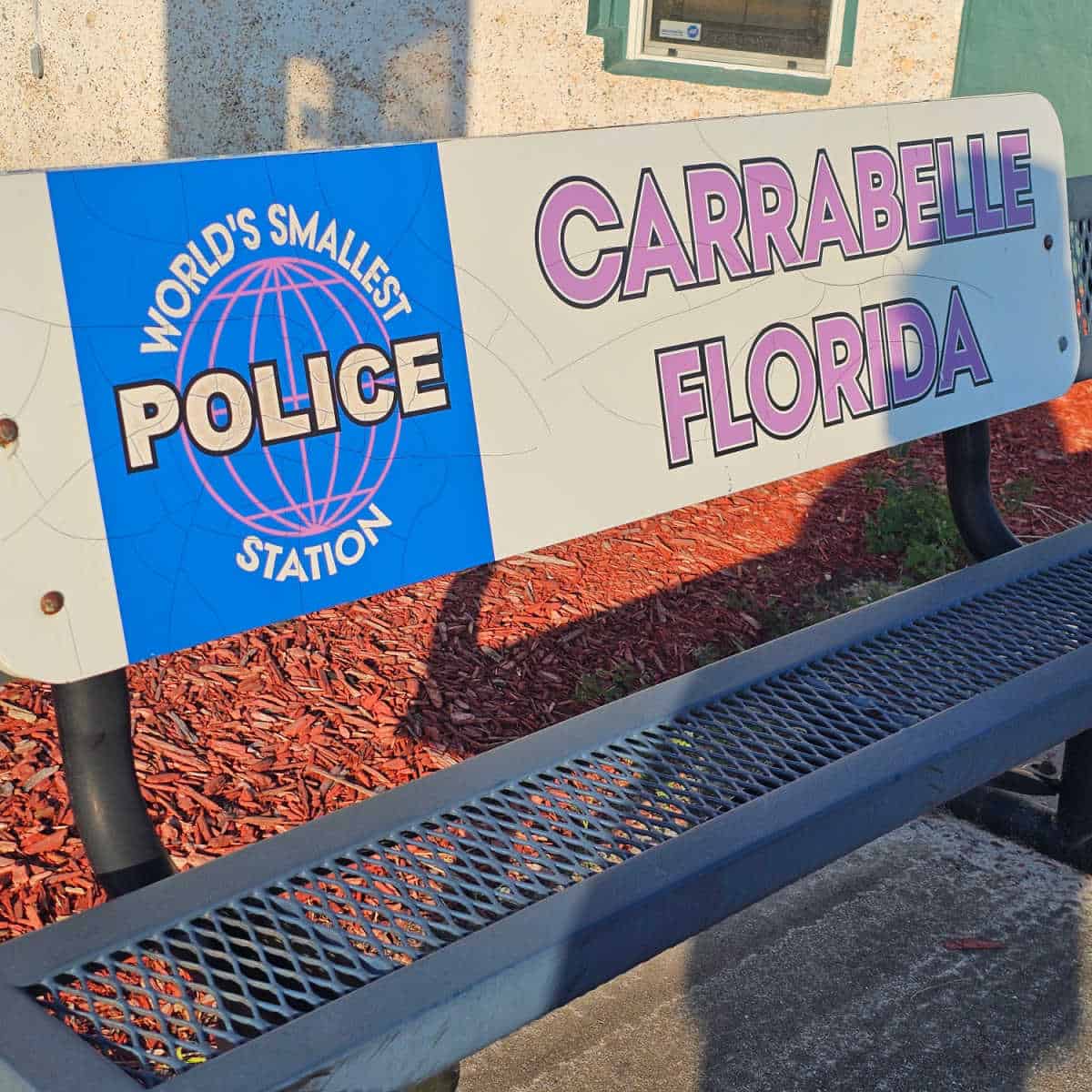 World's Smallest Police Station Carrabelle Florida on the top of a park bench