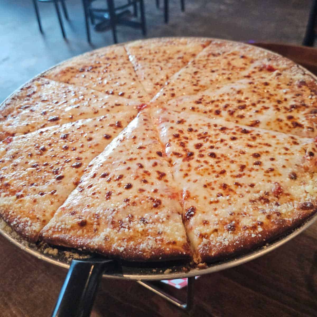 cheese pizza on a silver tray