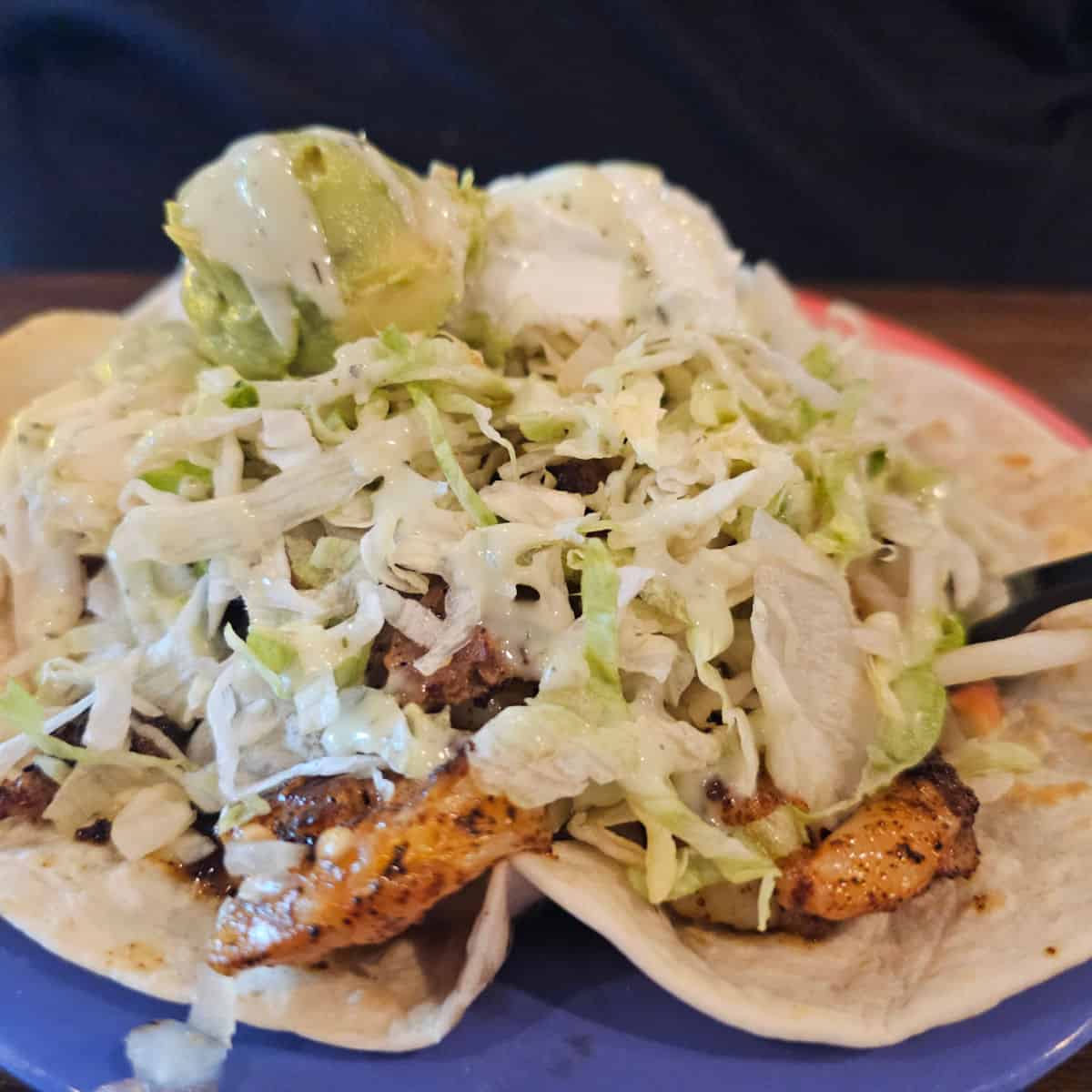 shrimp tacos on a blue plate