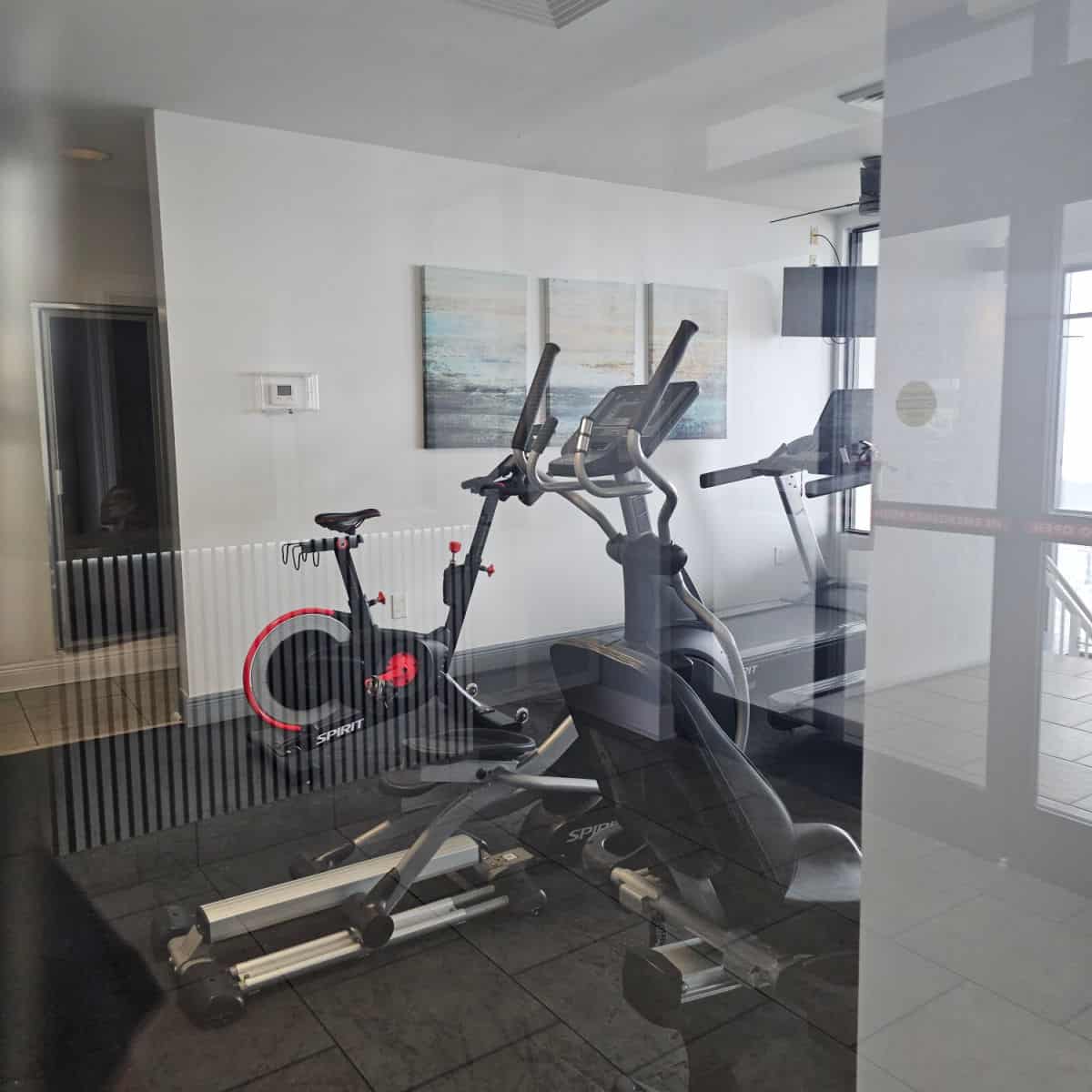 fitness center with bike, elliptical, and treadmill