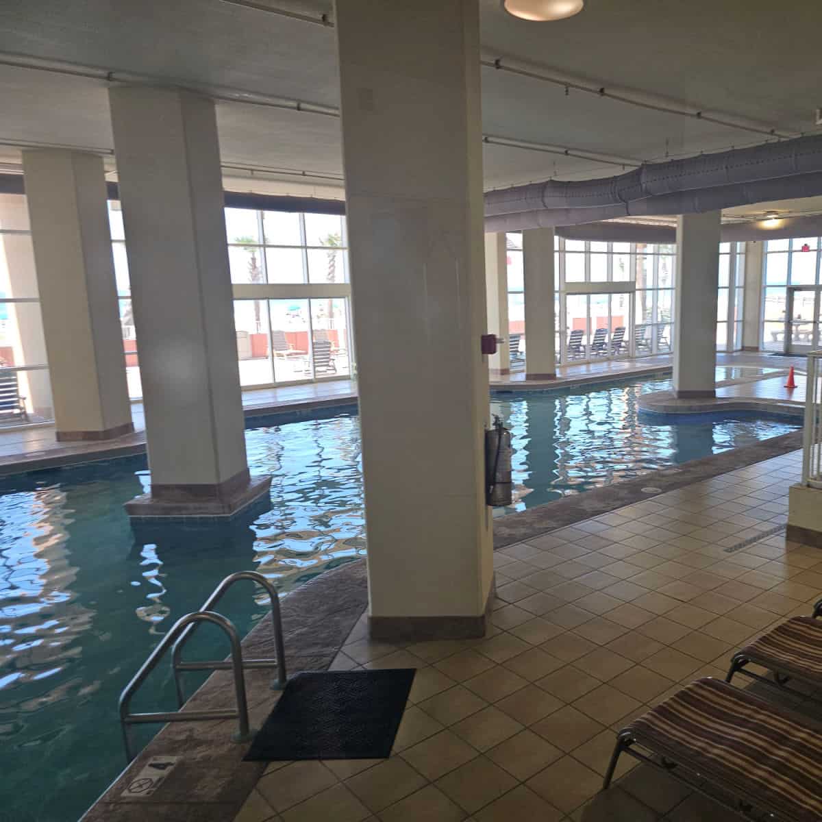 indoor pool with pillars in and around the pool
