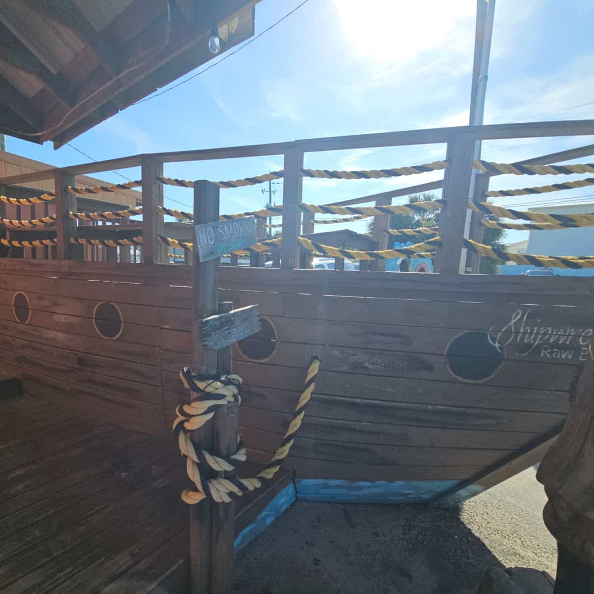 Wooden play structure in the shape of a ship
