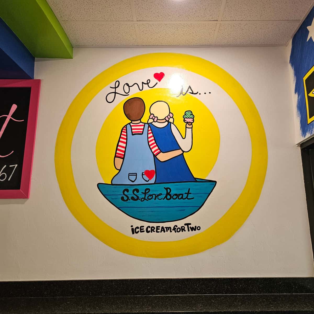 Love is Ice cream for two mural with a couple in a blue boat with ice cream cones