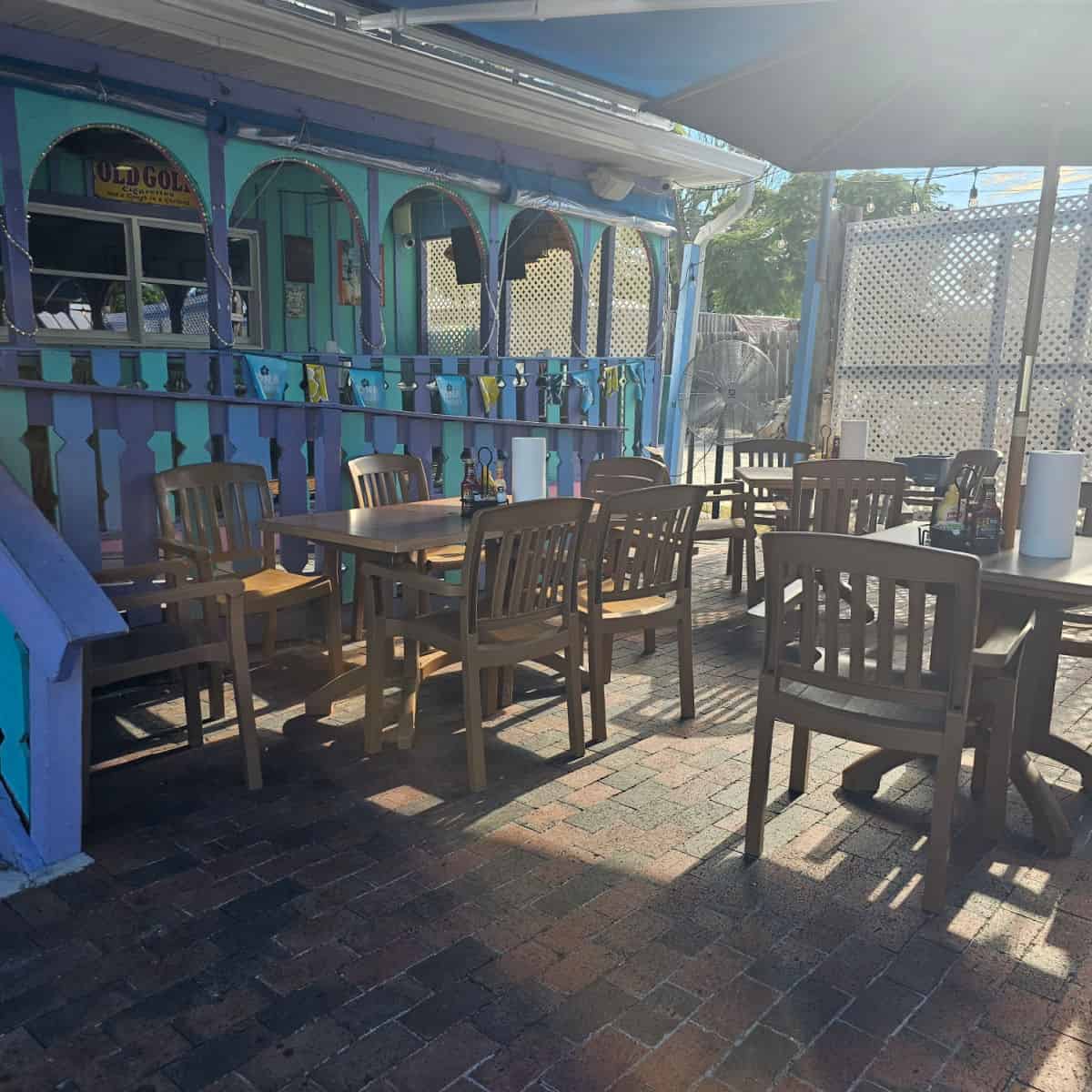 outdoor seating next to a purple and ble building