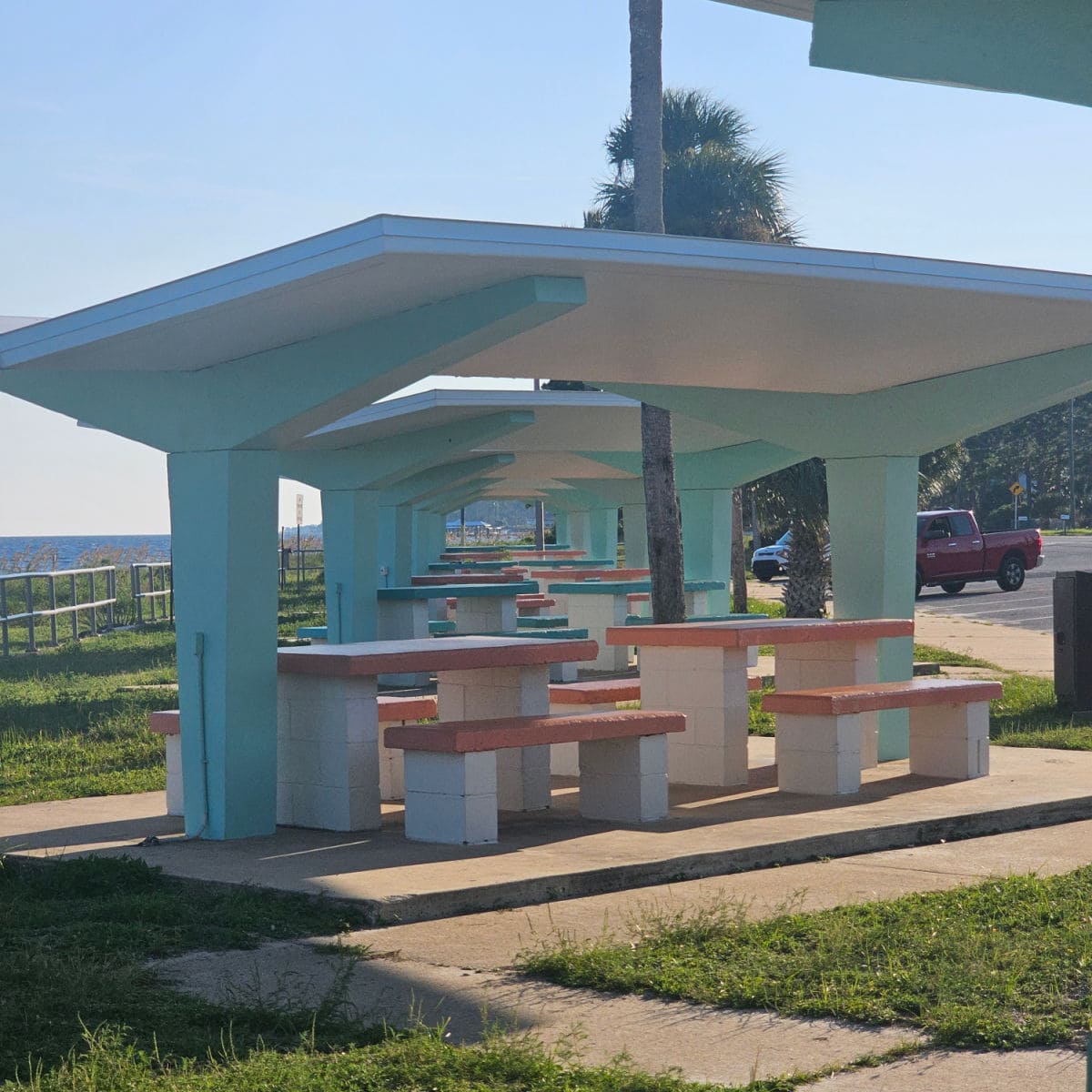 picnic shelters with colorful tops and covers that are retro looking
