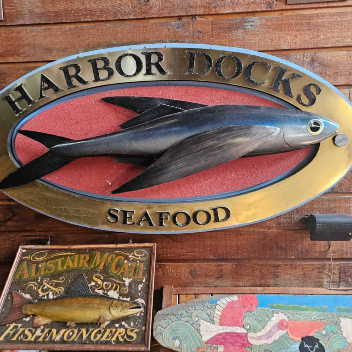 Harbor Docks Seafood sign with a fish in it