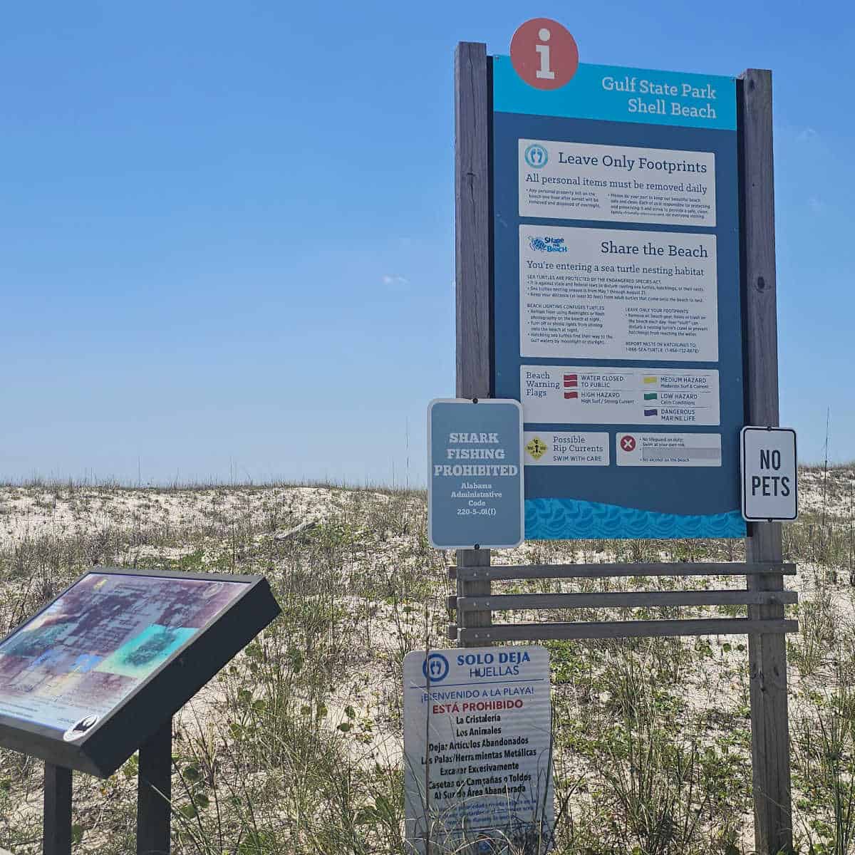 Gulf State Park Shell Beach sign with no pets, shark fishing prohibited,