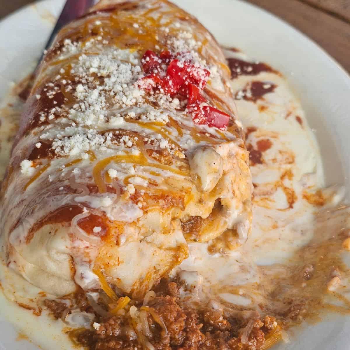 smothered burrito on a white plate