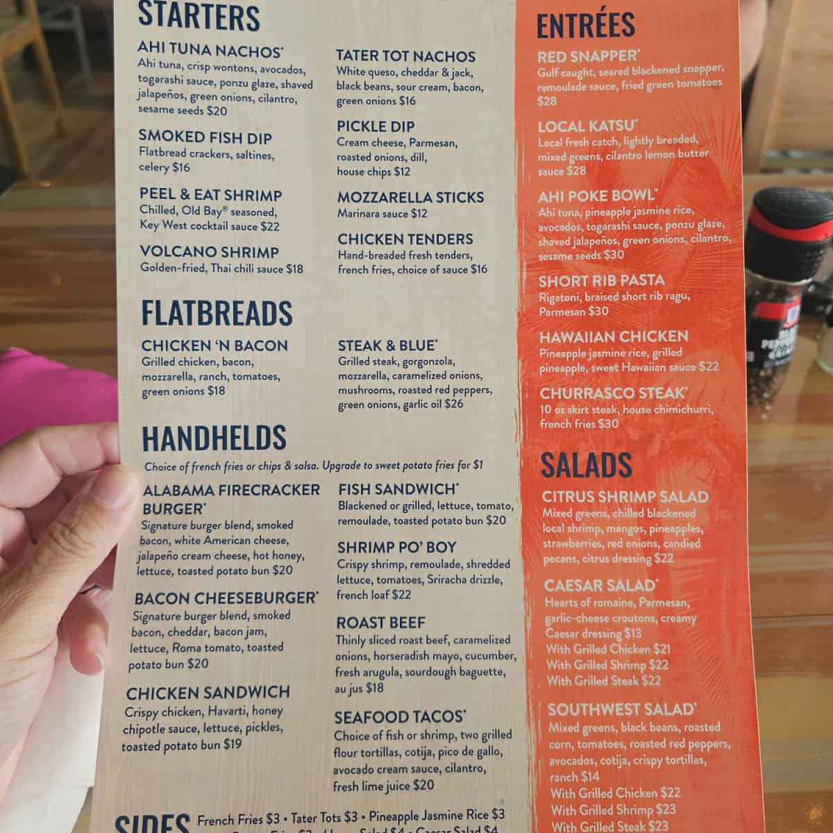 The last mango menu with starters, flatbreads, handhelds, entrees, and salads