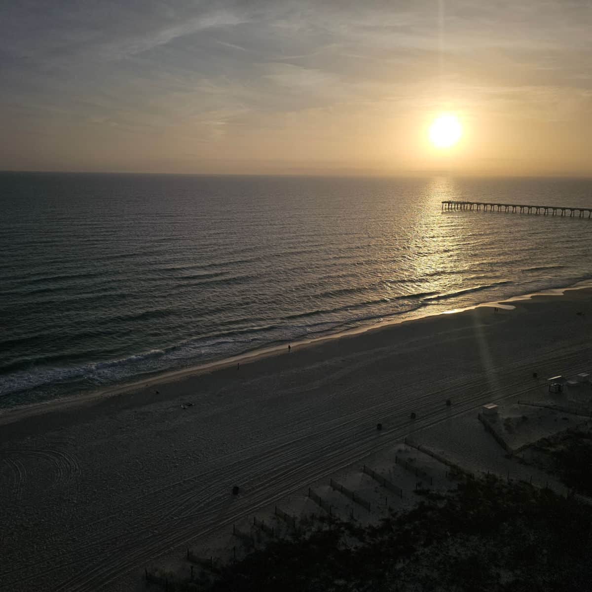 looking out over Panama City Beach Beach to the pier at sunset