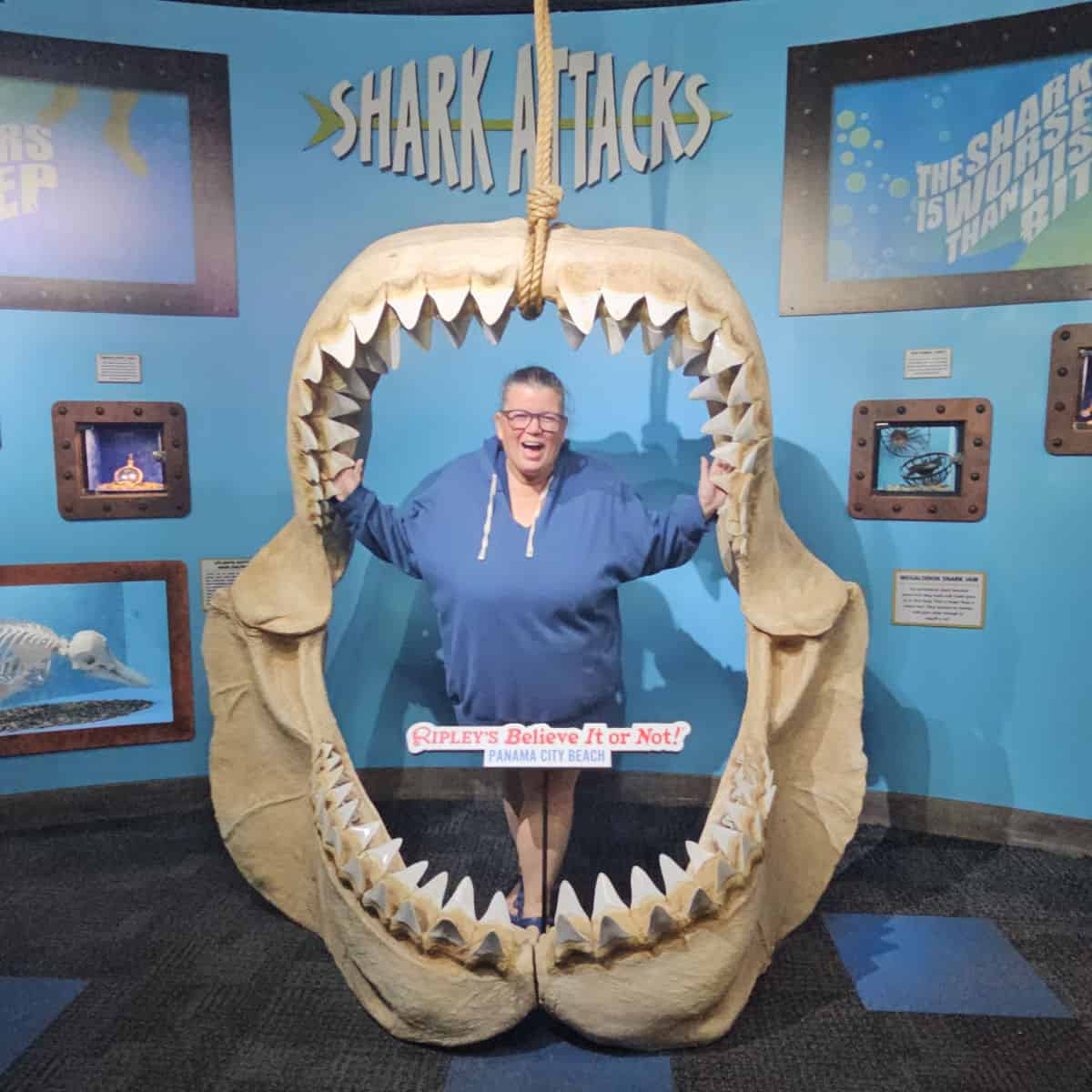 Tammilee inside a sharks mouth with Ripley's Believe it or Not Panama City Beach sign inside the mouth