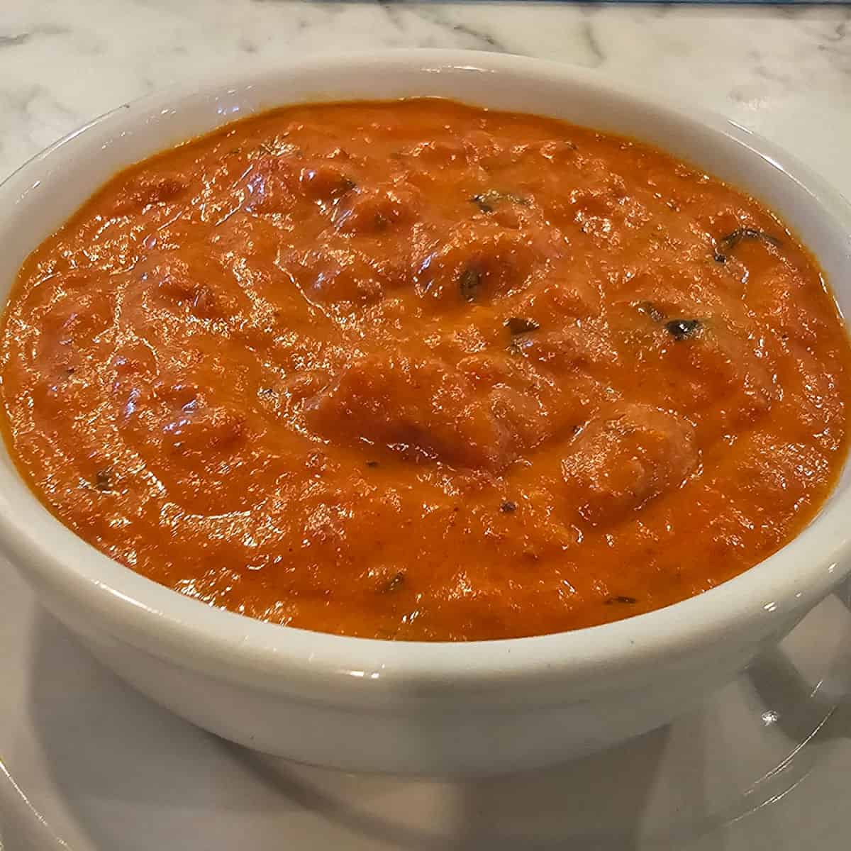 chunky tomato soup in a white bowl
