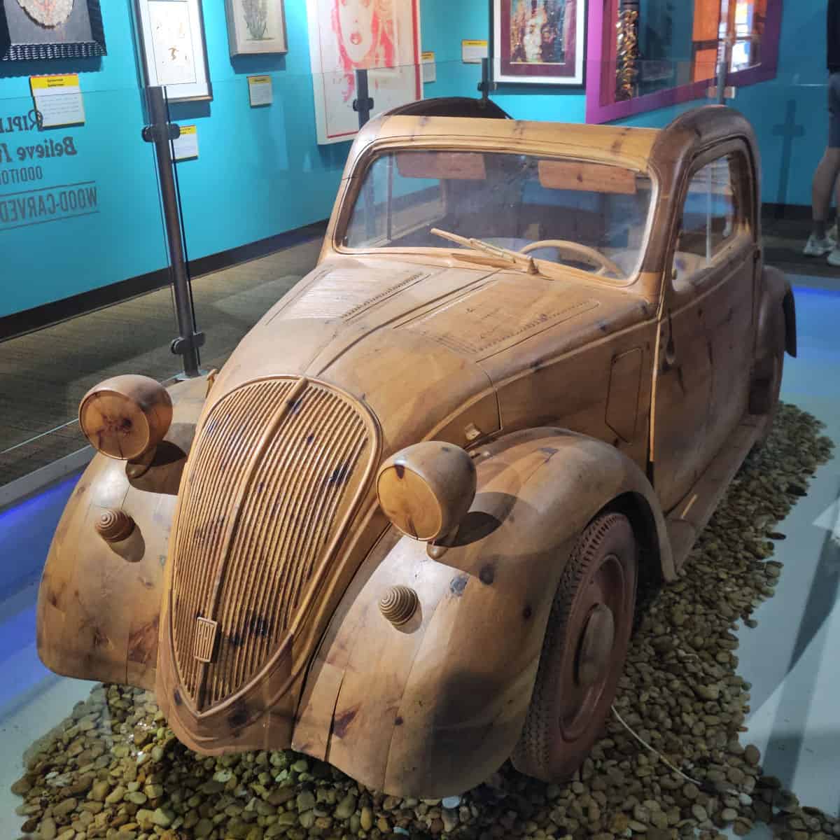 Old wooden vintage car exhibit at Gulf Coast Journeys museum.