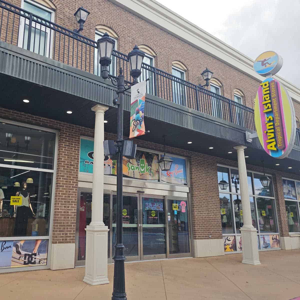 Alvin's Island surfboard sign over the entrance to the store