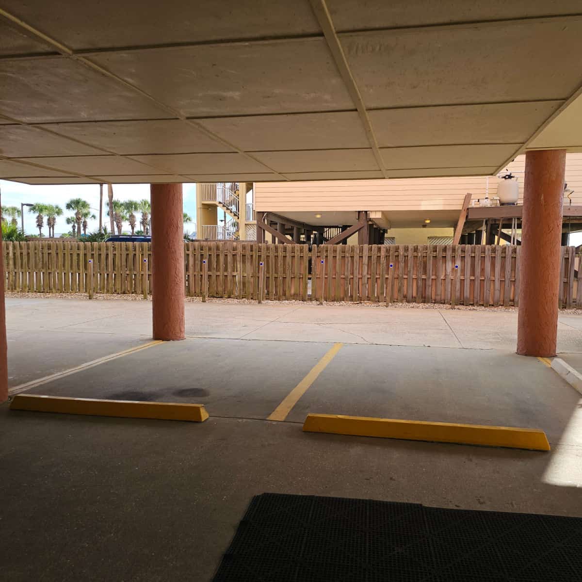 Parking under a building with painted columns