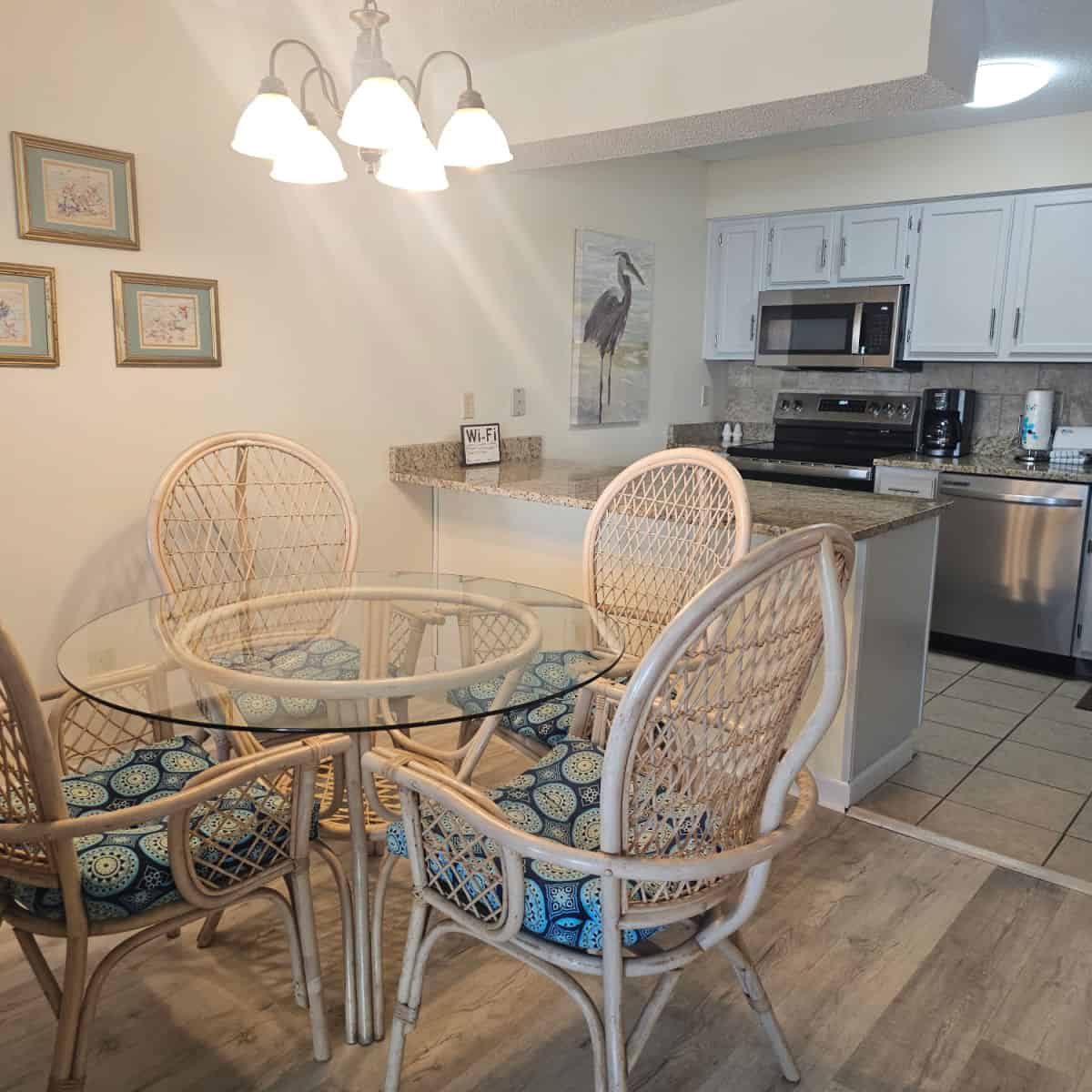 dining room and kitchen with art on the walll
